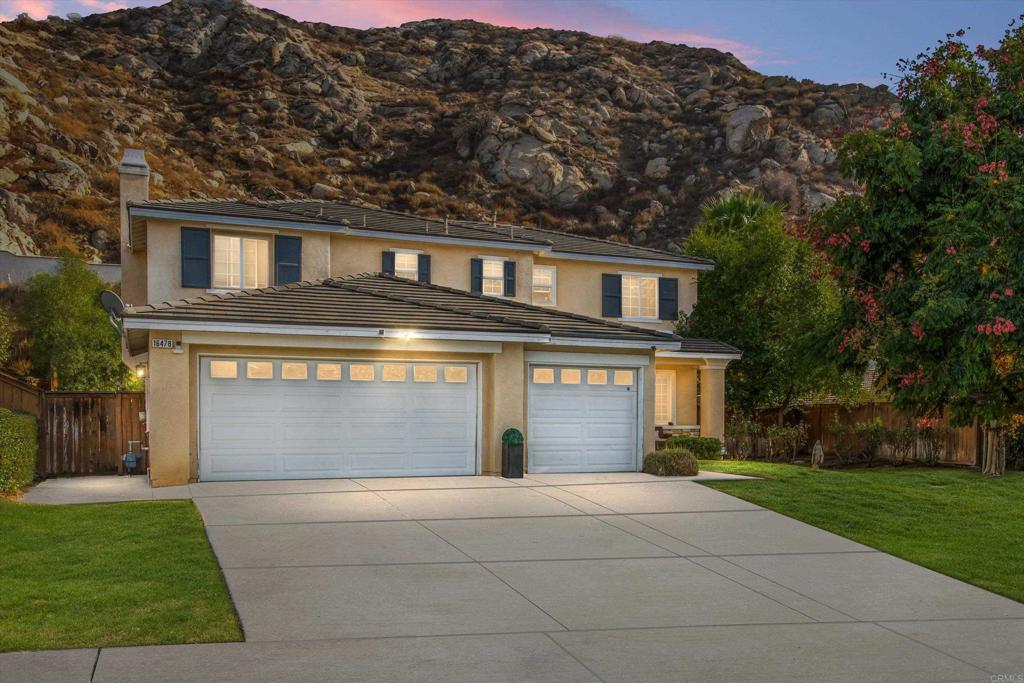 16478 Spirit Road Moreno Valley, CA 92555 - Photo 2 of 32 a front view of a house with garden