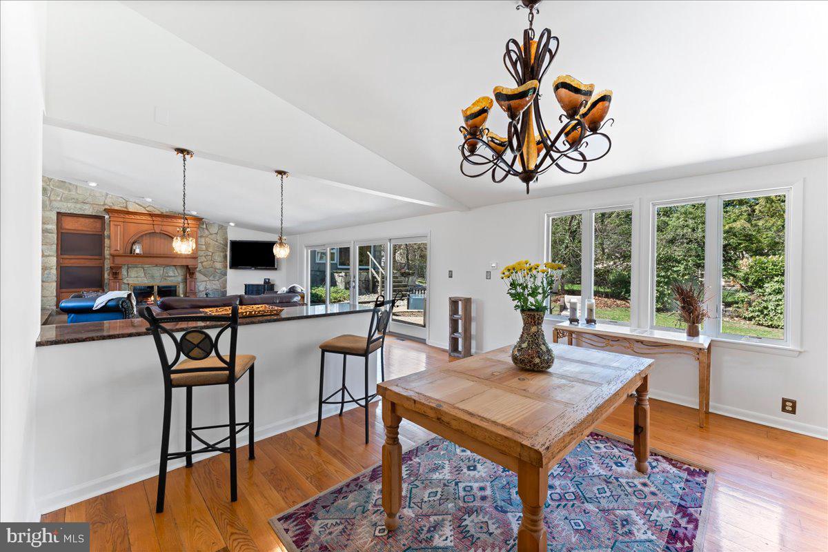 962 Frazier Road Rydal, PA 19046 - Photo 17 of 50 a kitchen with a table chairs and a painting on the wall