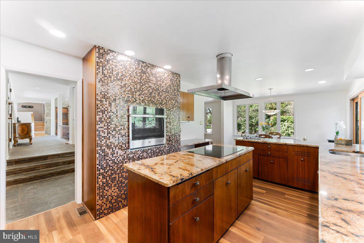 962 Frazier Road Rydal, PA 19046 - Photo 19 of 50 a kitchen with stainless steel appliances granite countertop a sink and a stove