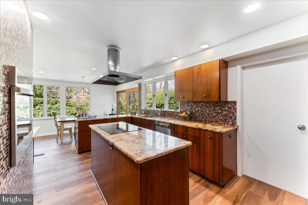 962 Frazier Road Rydal, PA 19046 - Photo 20 of 50 a kitchen with stainless steel appliances granite countertop a sink and a wooden floors