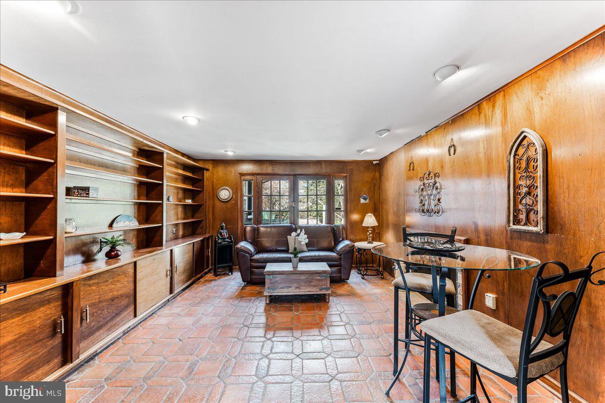 962 Frazier Road Rydal, PA 19046 - Photo 25 of 50 a living room with furniture and a book shelf