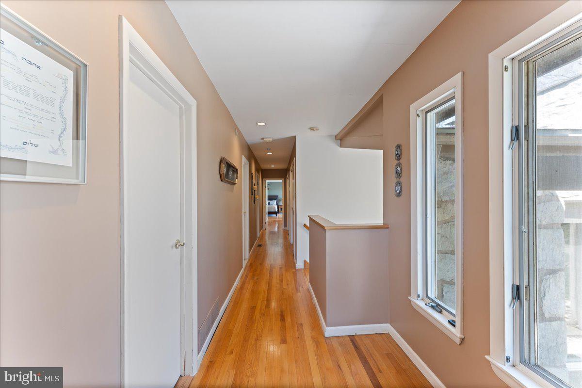 962 Frazier Road Rydal, PA 19046 - Photo 29 of 50 a view of a hallway with wooden floor and staircase