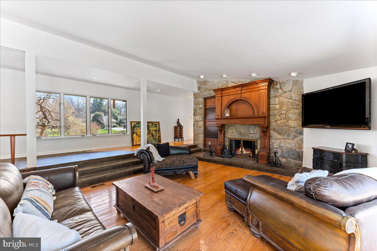 962 Frazier Road Rydal, PA 19046 - Photo 9 of 50 a living room with furniture a fireplace and a flat screen tv