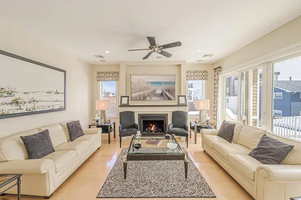 a view of a brick house with a chairs in patio