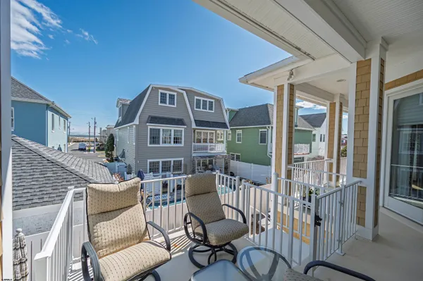a large kitchen with a table and chairs