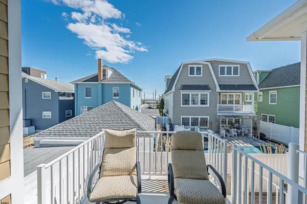 a kitchen with a sink and dishwasher with wooden cabinets