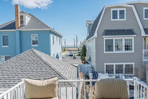 a bed room with a bed and a chair