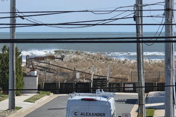 a bathroom with a double vanity sink toilet and shower