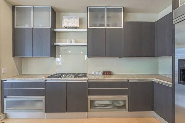 a room with a sink and a mirror