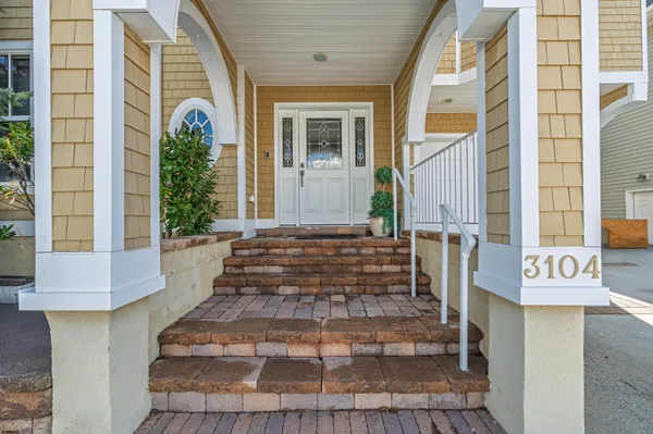 a living room with furniture gym equipment and a view of kitchen