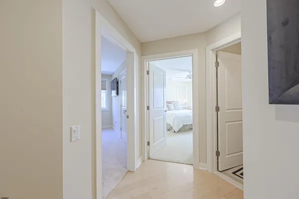 a view of staircase with wooden floor and a rug