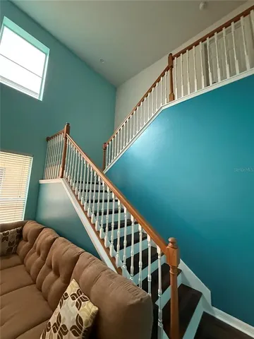 a living room with a couch and a window