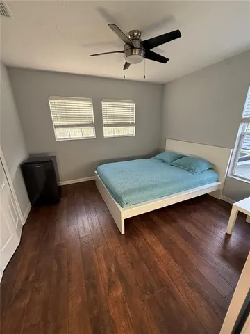a living room with lots of furniture and a flat screen tv