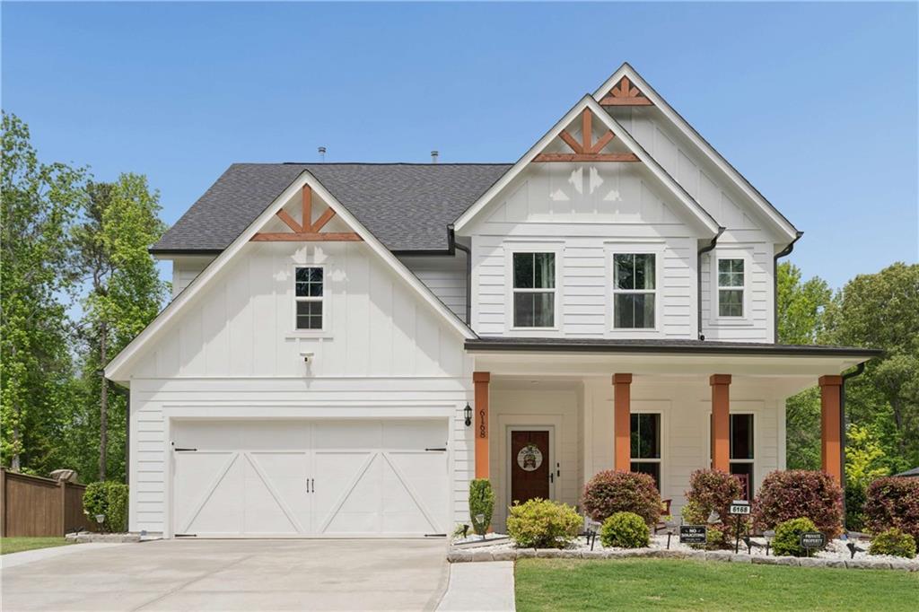 6168 Collins Road Acworth, GA 30101 - Photo 1 of 41 a front view of a house with garden