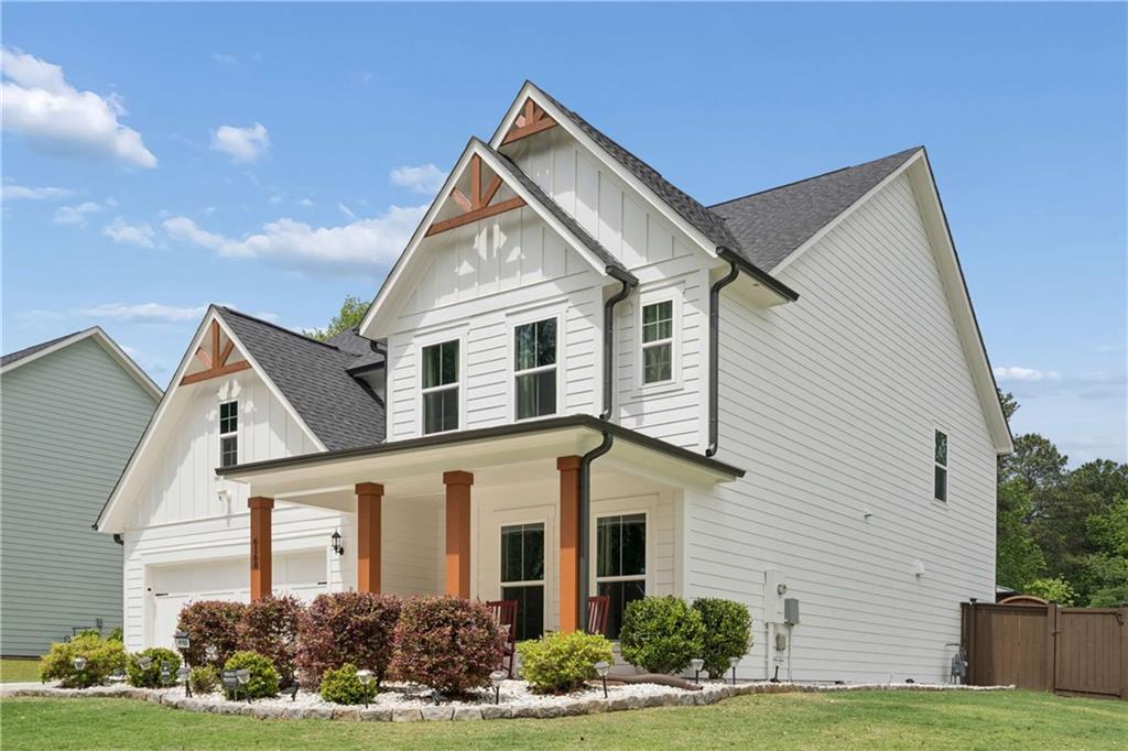 6168 Collins Road Acworth, GA 30101 - Photo 2 of 41 a front view of a house with garden