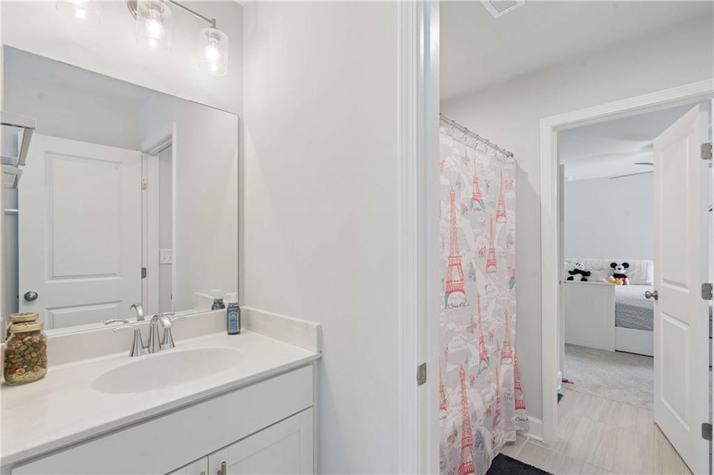 6168 Collins Road Acworth, GA 30101 - Photo 24 of 41 a bathroom with a sink vanity tub and shower