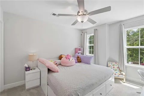 a bedroom with a bed and window