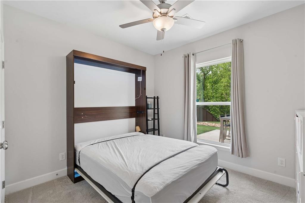 6168 Collins Road Acworth, GA 30101 - Photo 27 of 41 a bedroom with a bed and window