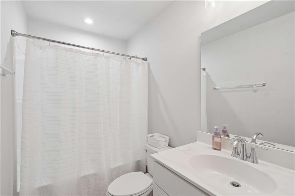 6168 Collins Road Acworth, GA 30101 - Photo 28 of 41 a bathroom with a sink and a mirror
