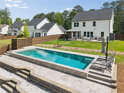 a view of a house with a big yard