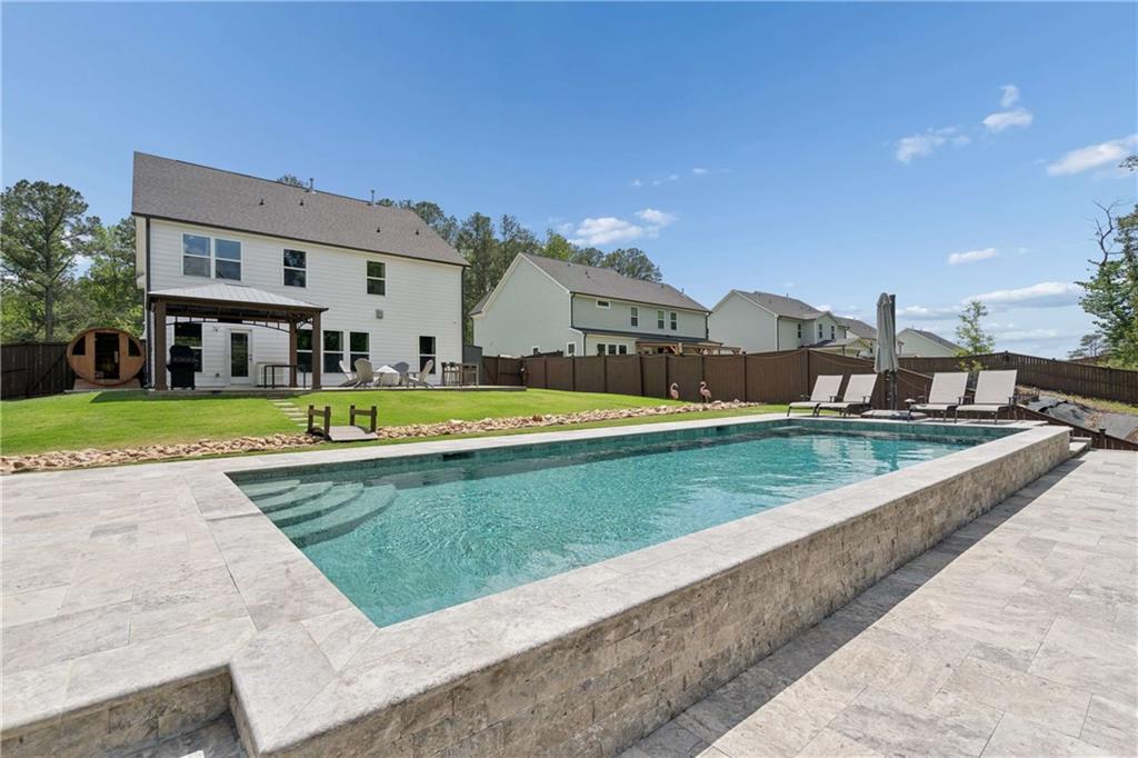 6168 Collins Road Acworth, GA 30101 - Photo 30 of 41 a view of a house with a swimming pool
