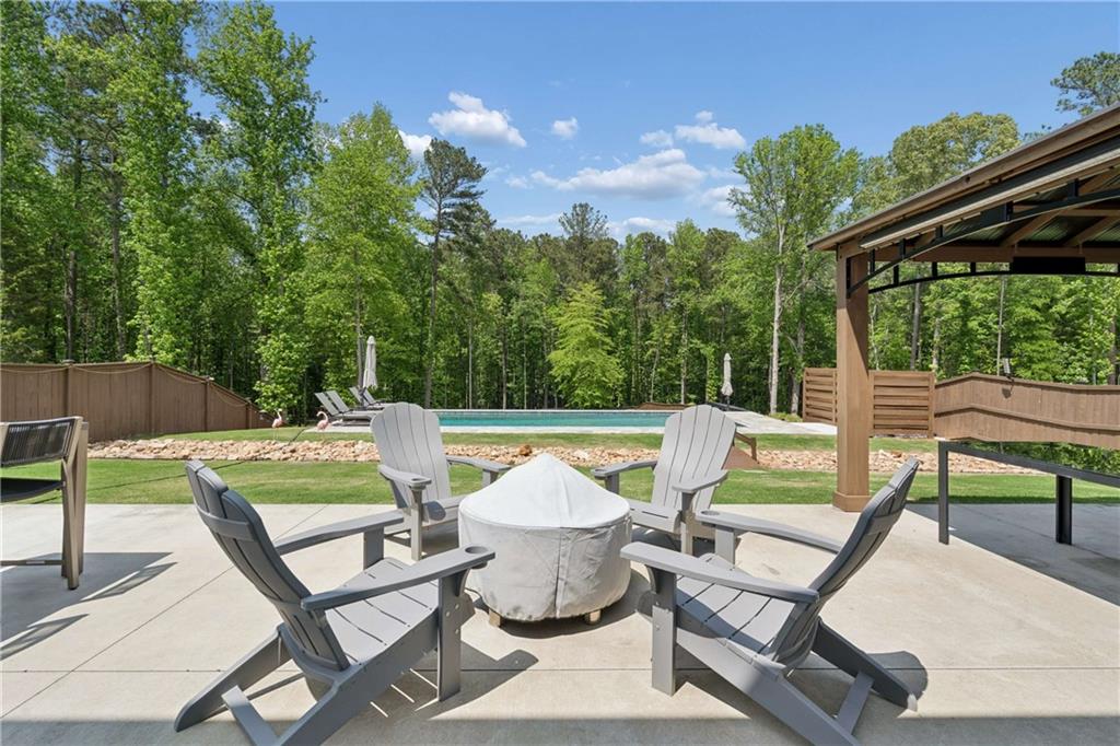 6168 Collins Road Acworth, GA 30101 - Photo 32 of 41 a view of backyard with seating area and green space