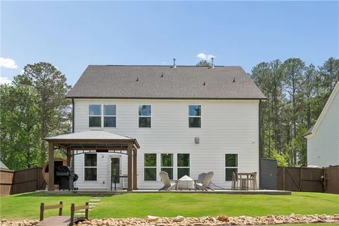 a aerial view of a house with a yard