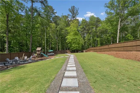 a view of a backyard with sitting area