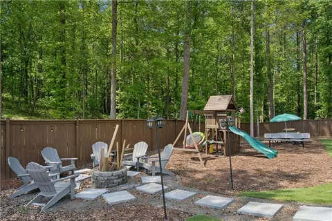 a view of a deck with a table and chairs