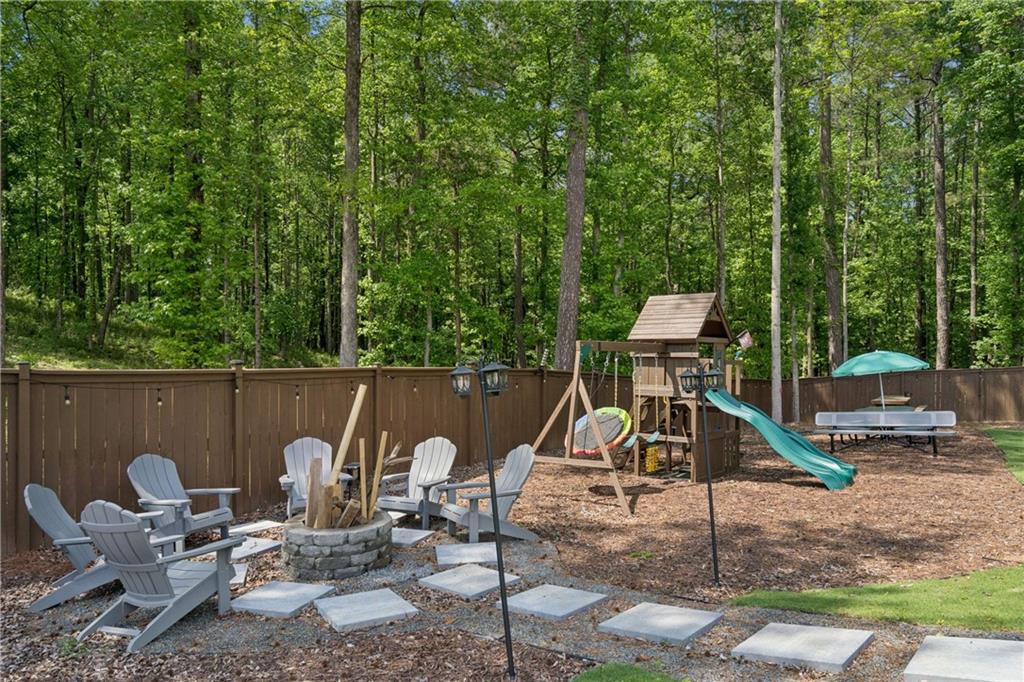 6168 Collins Road Acworth, GA 30101 - Photo 39 of 41 a view of a deck with a table and chairs