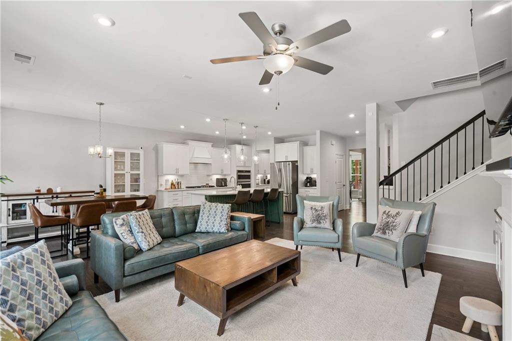 6168 Collins Road Acworth, GA 30101 - Photo 7 of 41 a living room with furniture kitchen view and a chandelier