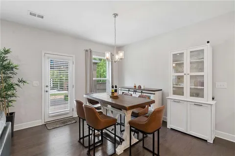 a dining room with furniture window wooden floor