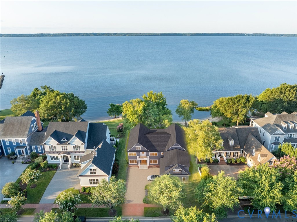 an aerial view of a house with lots of swimming pool