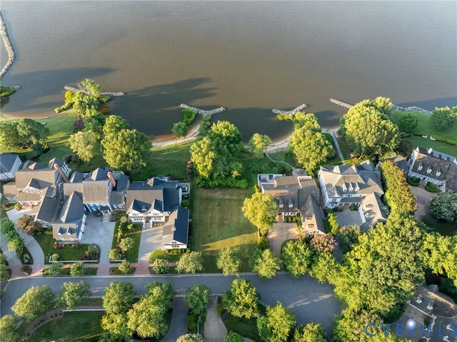 an aerial view of a houses with yard