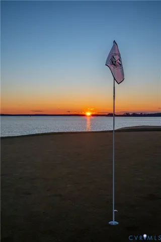 a view of a house with wooden deck and furniture