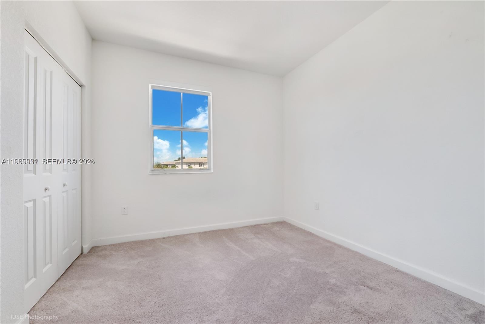 1705 Southeast 27th Street Homestead, FL 33035 - Photo 11 of 17 an empty room with windows