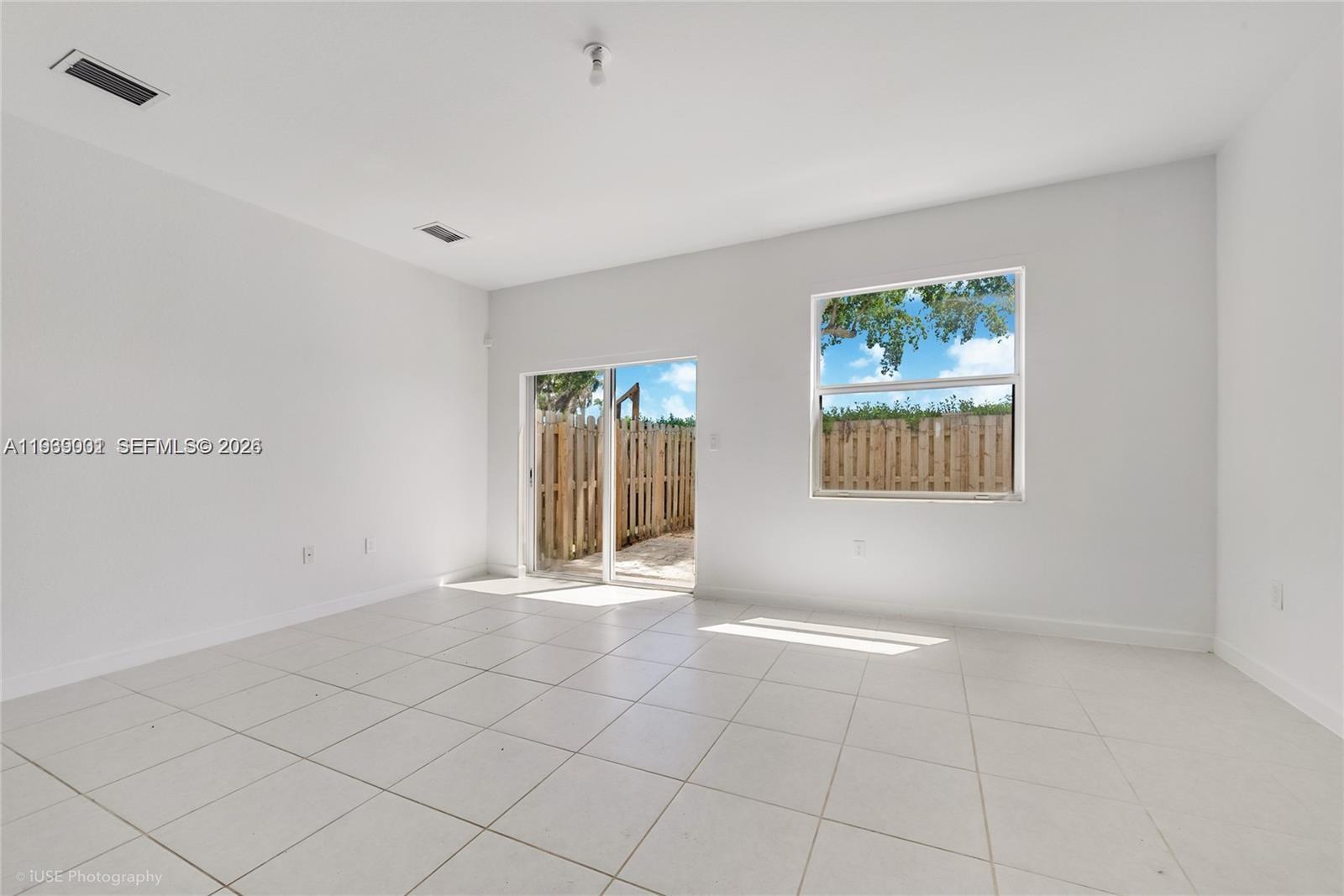 1705 Southeast 27th Street Homestead, FL 33035 - Photo 6 of 17 a view of an empty room with a window