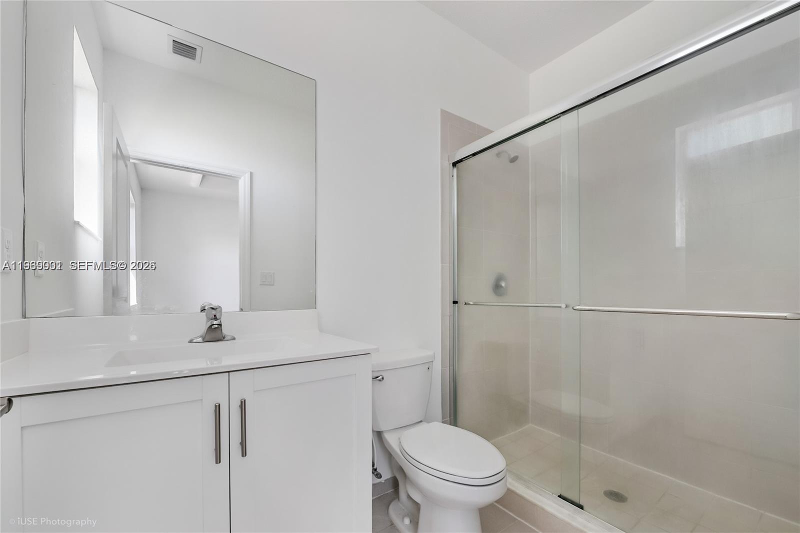 1705 Southeast 27th Street Homestead, FL 33035 - Photo 9 of 17 a bathroom with a sink toilet and shower