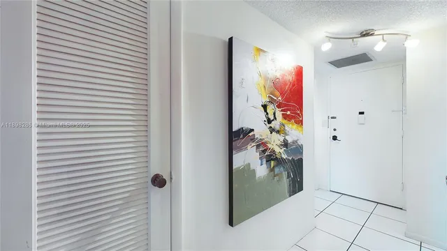 a view of a hallway with paintings on the wall