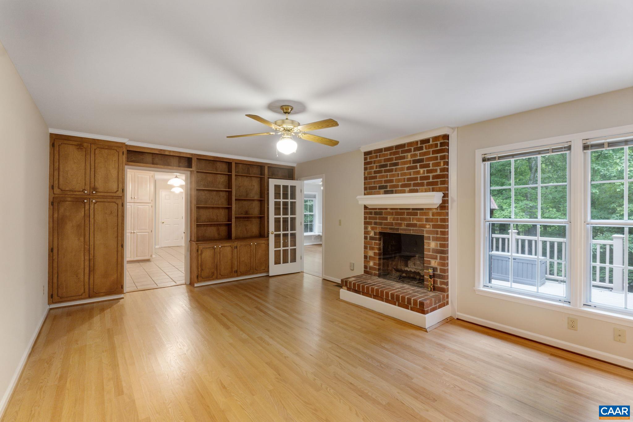 41 Colonial Road Palmyra, VA 22963 - Photo 20 of 53 an empty room with wooden floor and fireplace