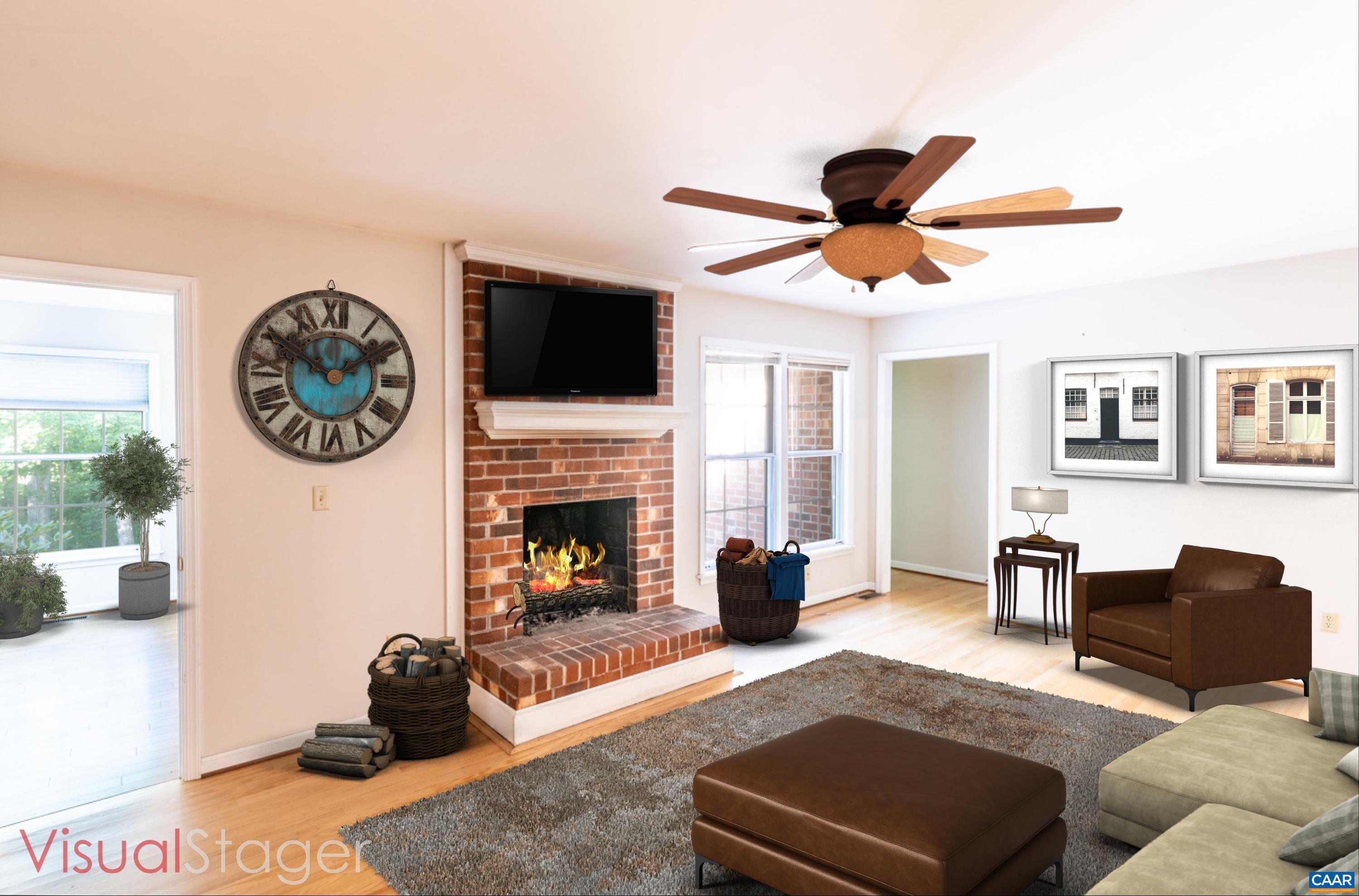 41 Colonial Road Palmyra, VA 22963 - Photo 21 of 53 a living room with furniture a flat screen tv and a fireplace