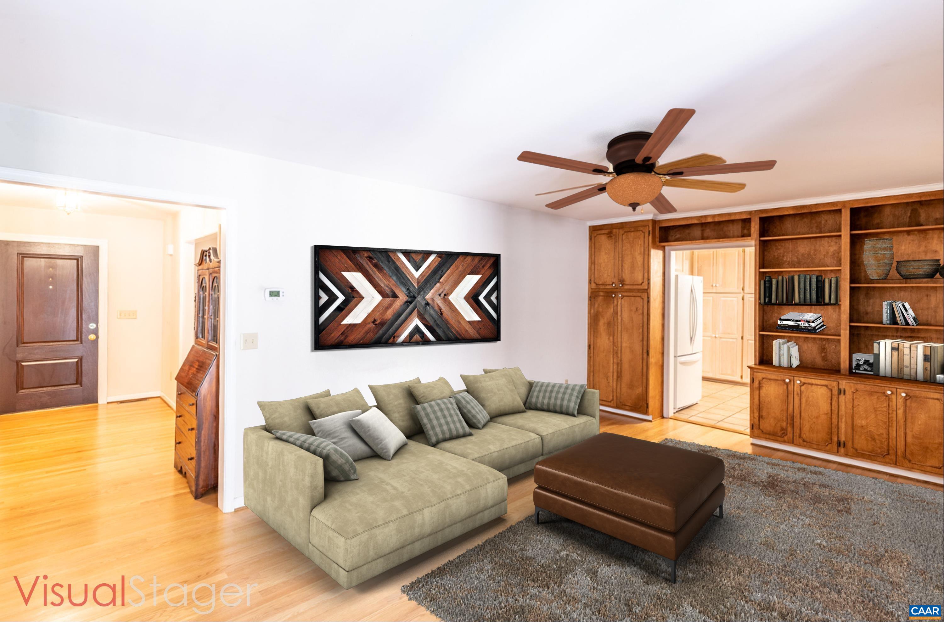 41 Colonial Road Palmyra, VA 22963 - Photo 22 of 53 a living room with furniture and a book shelf
