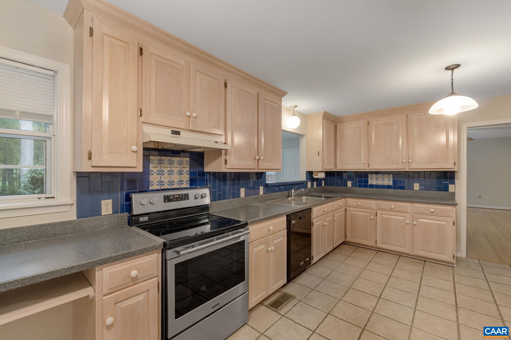 41 Colonial Road Palmyra, VA 22963 - Photo 27 of 53 a kitchen with a stove a sink and a refrigerator