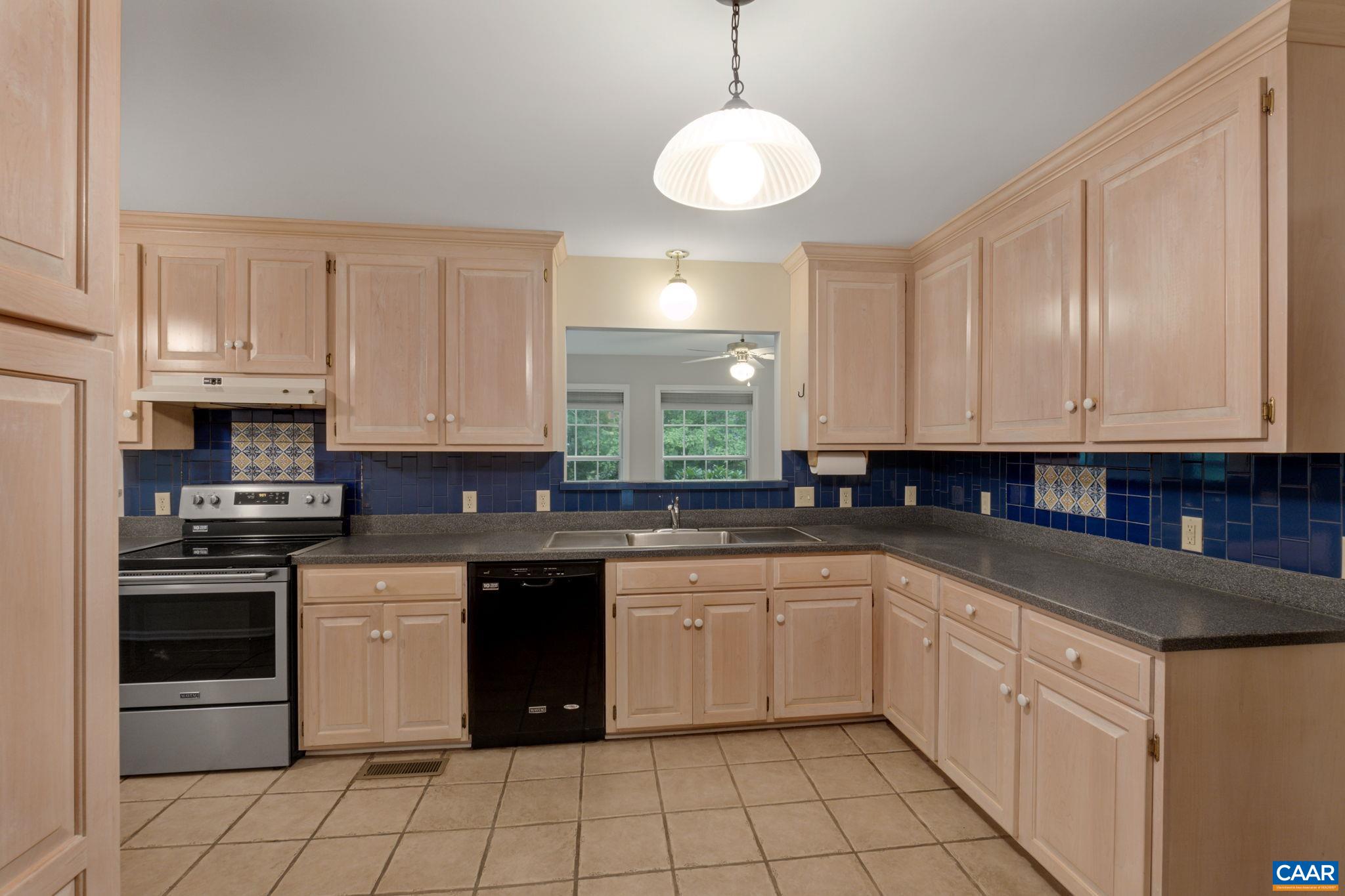 41 Colonial Road Palmyra, VA 22963 - Photo 28 of 53 a kitchen with a sink stove and cabinets