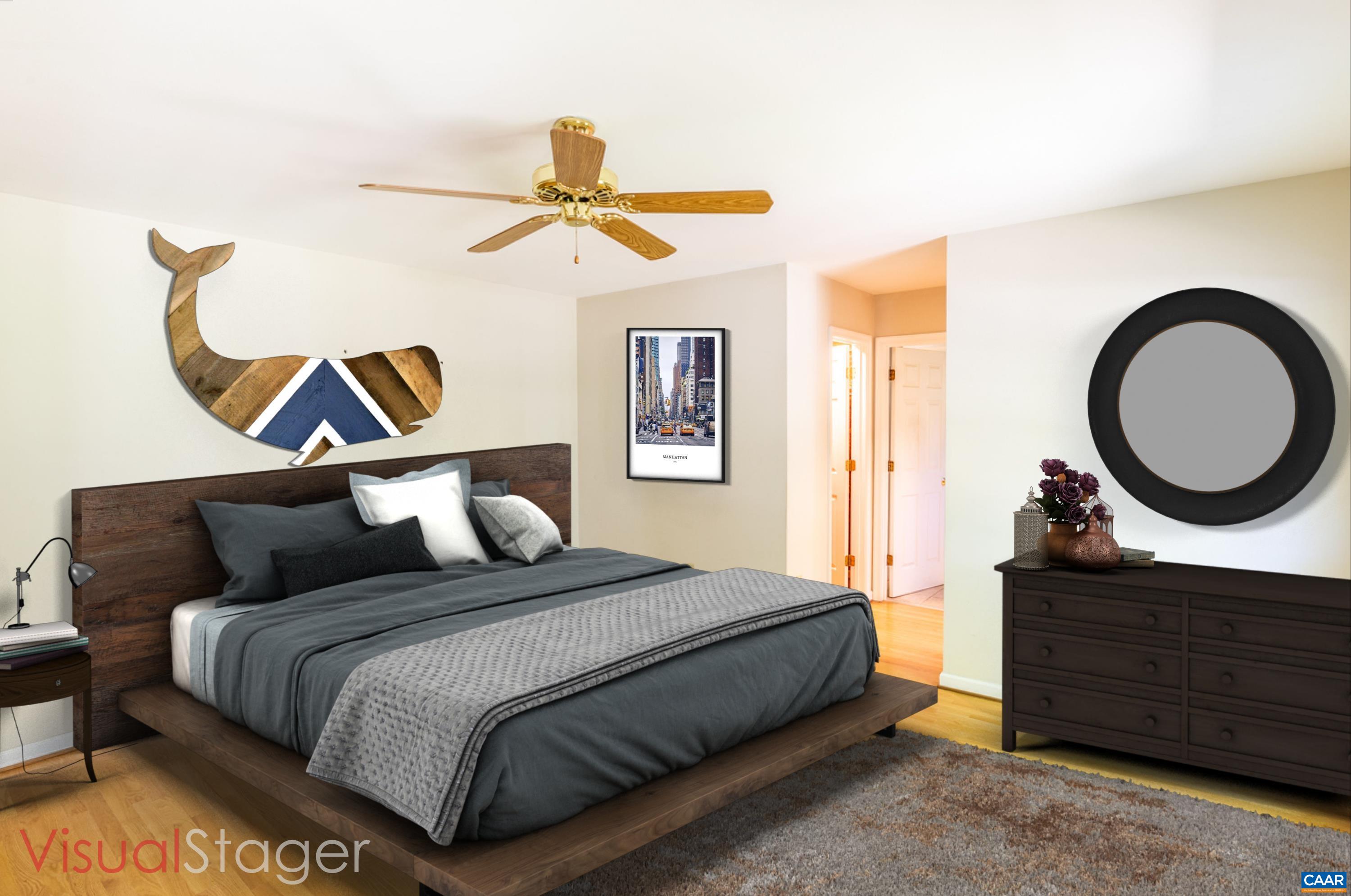 41 Colonial Road Palmyra, VA 22963 - Photo 36 of 53 a bedroom with a bed and a mirror on the dresser