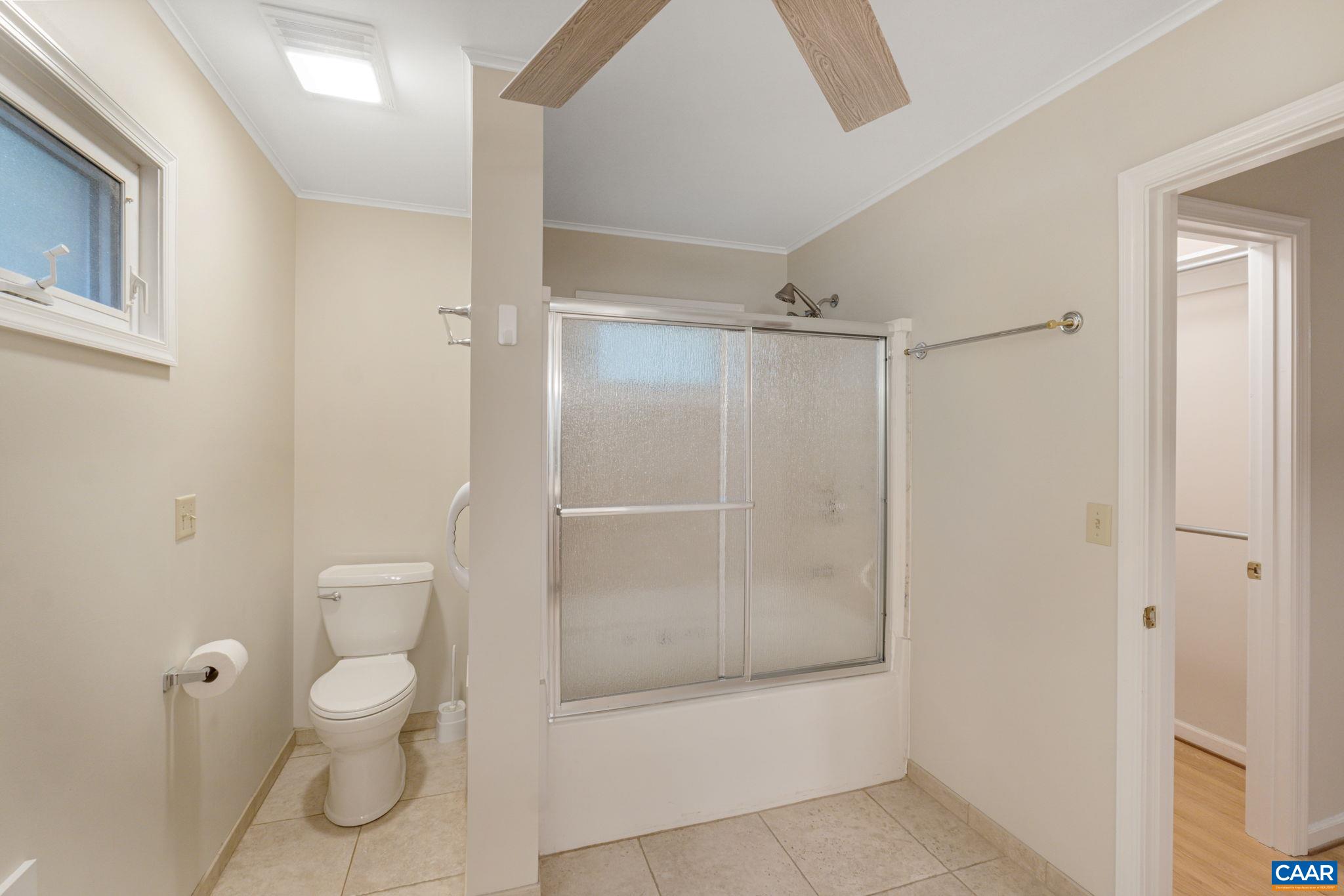 41 Colonial Road Palmyra, VA 22963 - Photo 37 of 53 a bathroom with a granite countertop toilet and a shower
