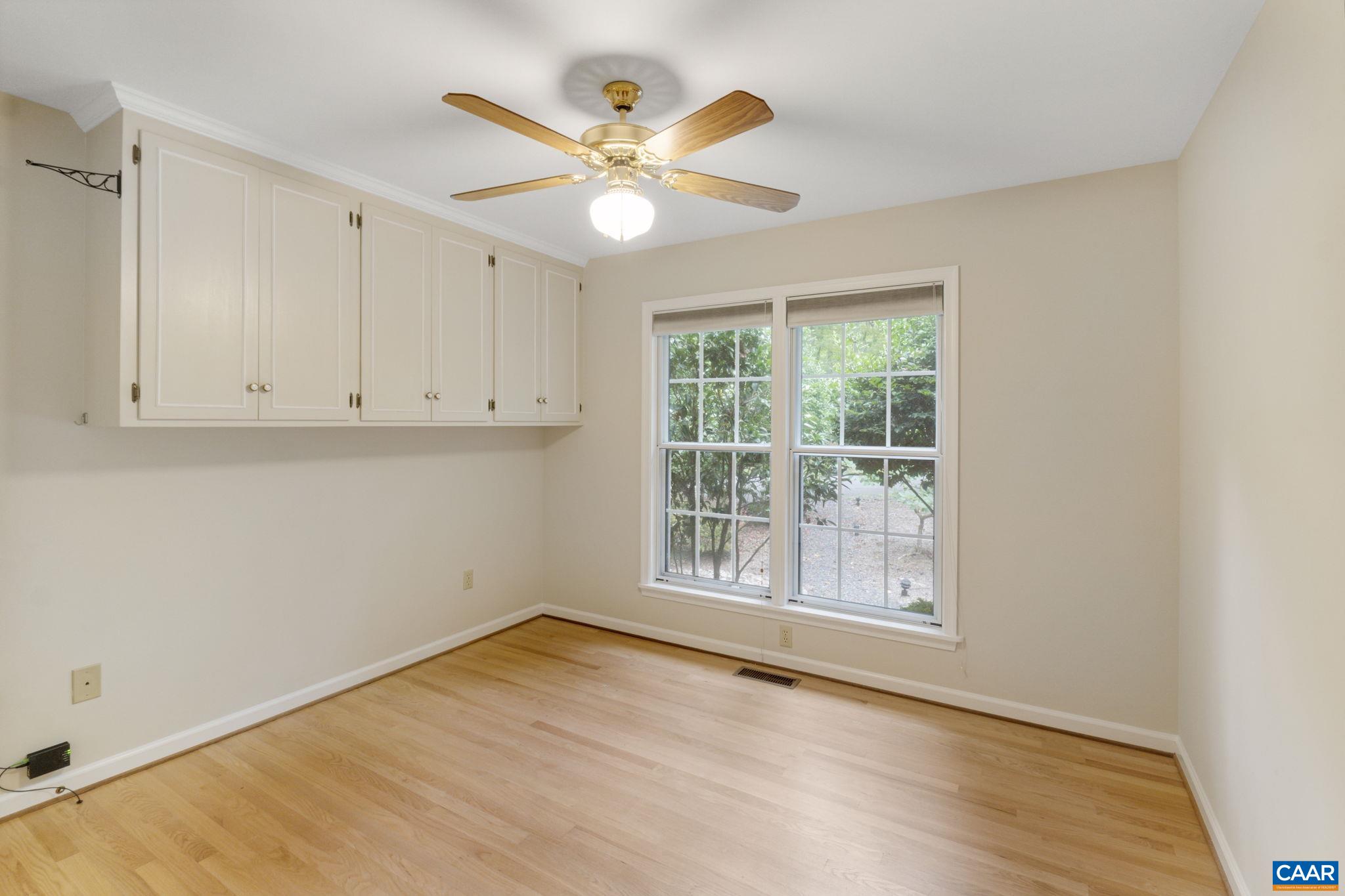 41 Colonial Road Palmyra, VA 22963 - Photo 42 of 53 an empty room with wooden floor fan and windows
