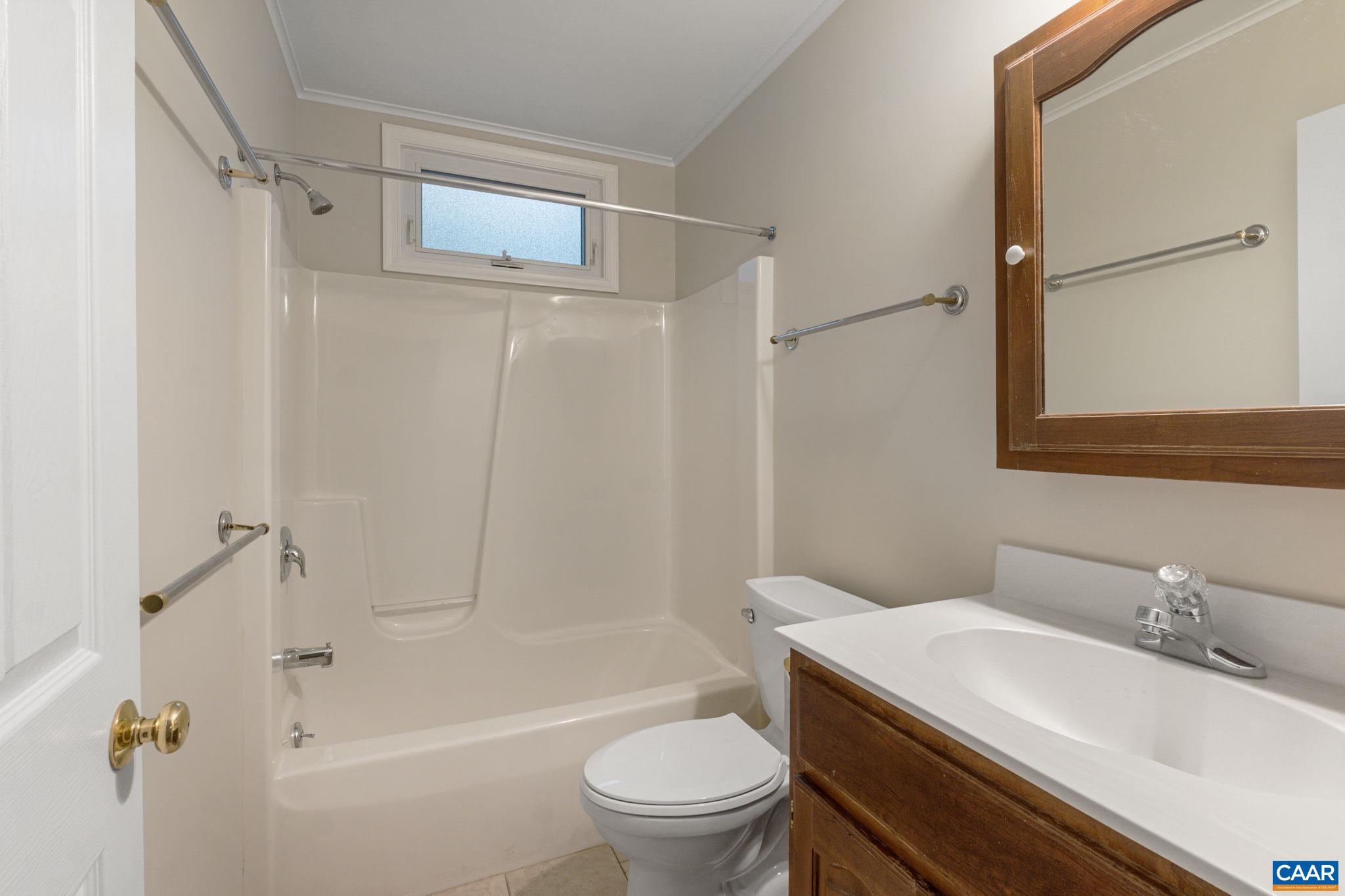 41 Colonial Road Palmyra, VA 22963 - Photo 44 of 53 a bathroom with a sink toilet and shower