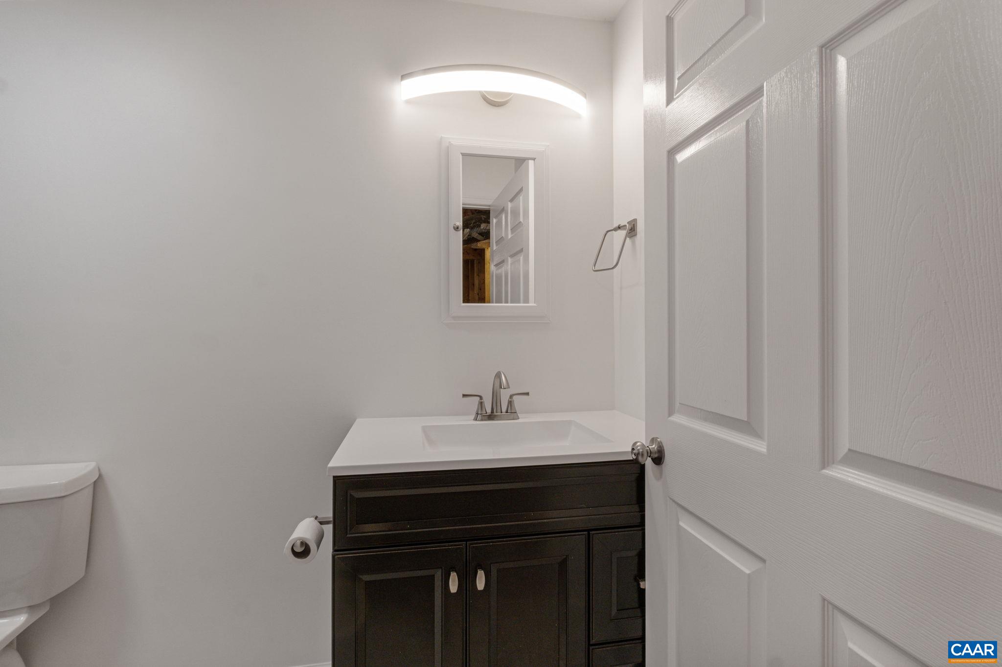 41 Colonial Road Palmyra, VA 22963 - Photo 50 of 53 a bathroom with a sink and a mirror