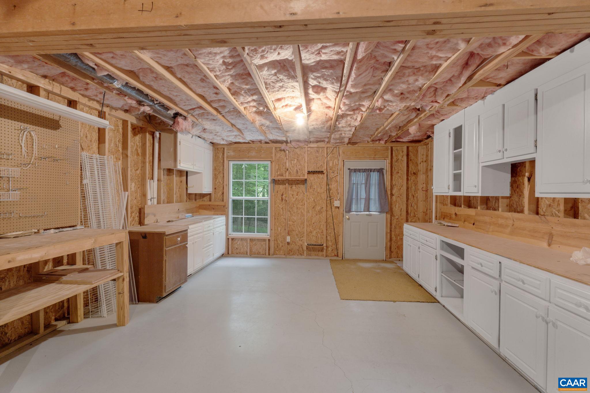 41 Colonial Road Palmyra, VA 22963 - Photo 51 of 53 a large kitchen with stainless steel appliances wooden cabinets and a stove